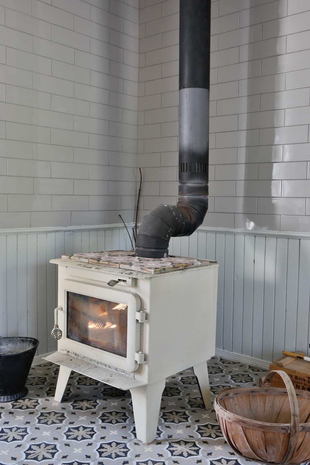 Vintage wood stove on ornate tiled floor