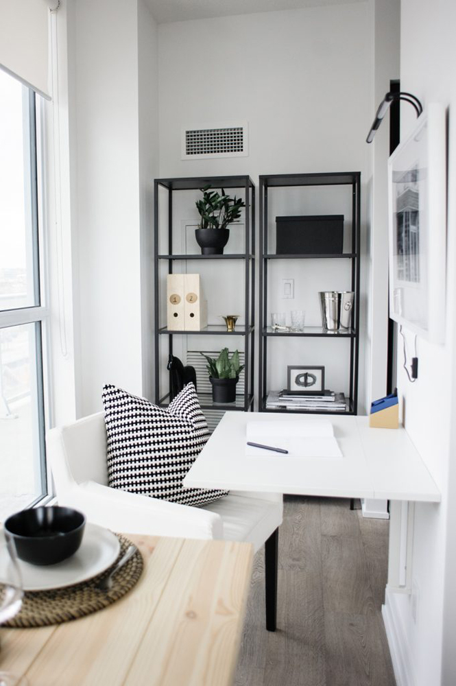 Black and white Ikea hidden office with folding desk