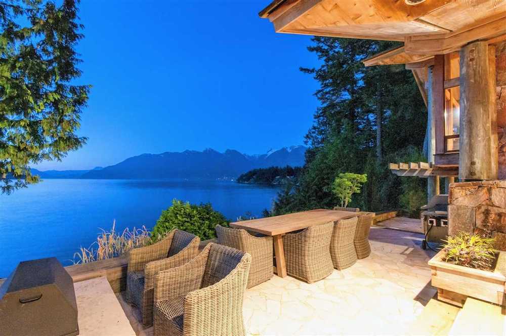 Outdoor furniture on deck overlooking ocean