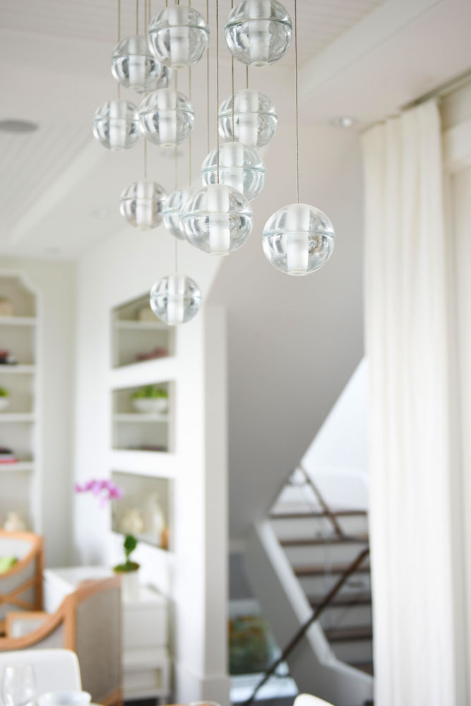 close up of dining room clear globule chandelier
