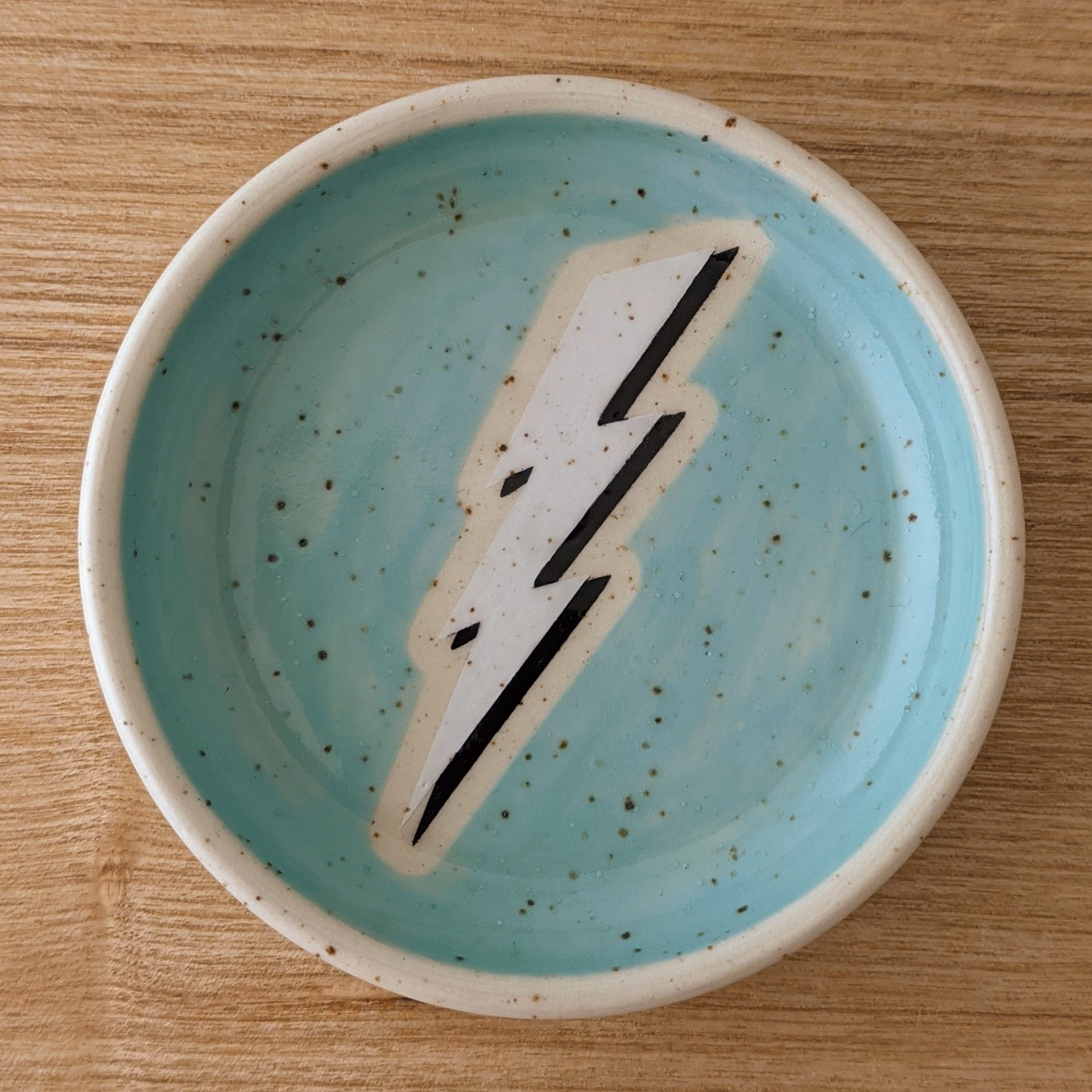 Small ceramic dish with lightning bolt