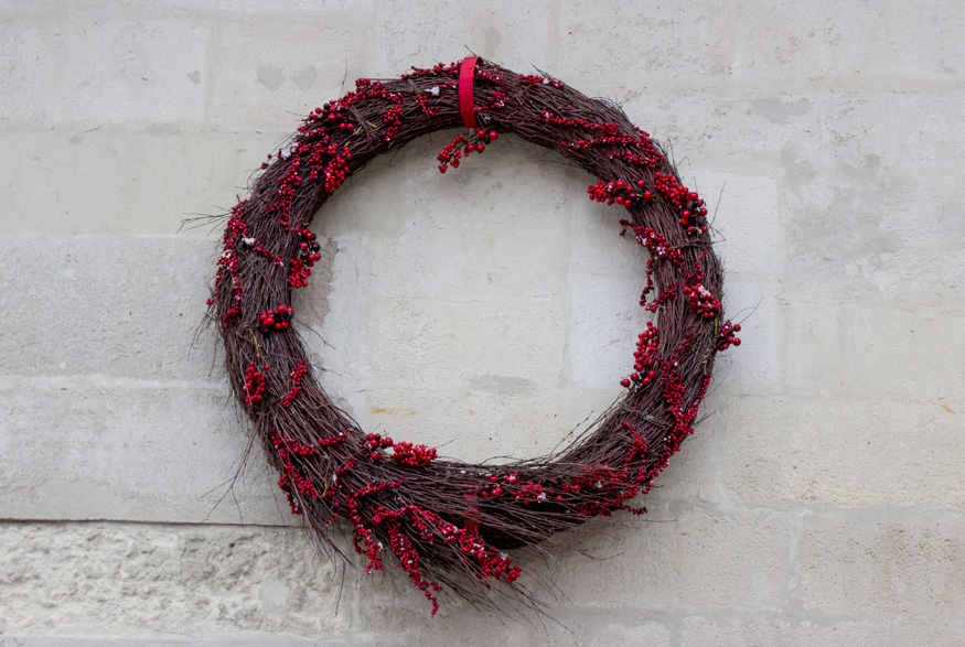 Stylish wreath on wall