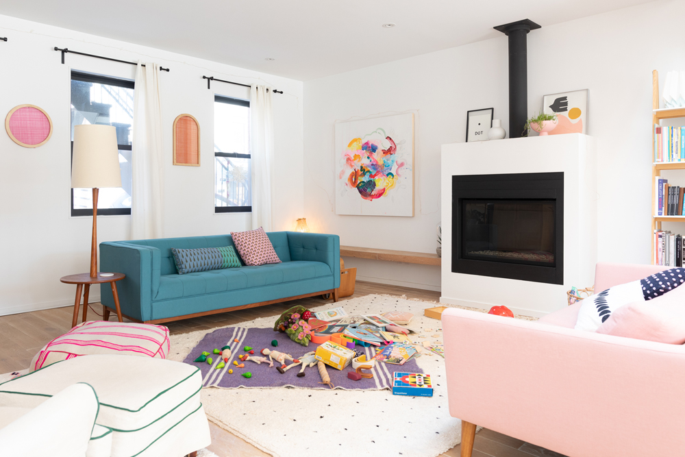 living room with kids' toys on rug