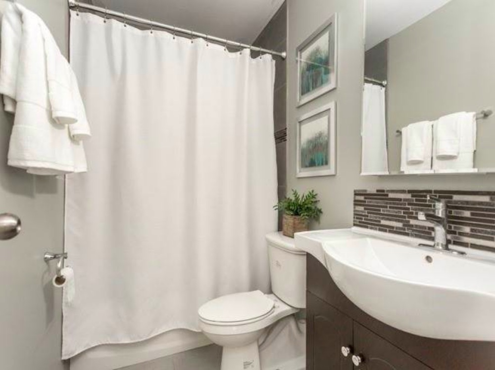 Small bathroom with shower curtain