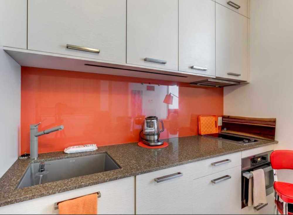 White kitchen with colourful backsplash