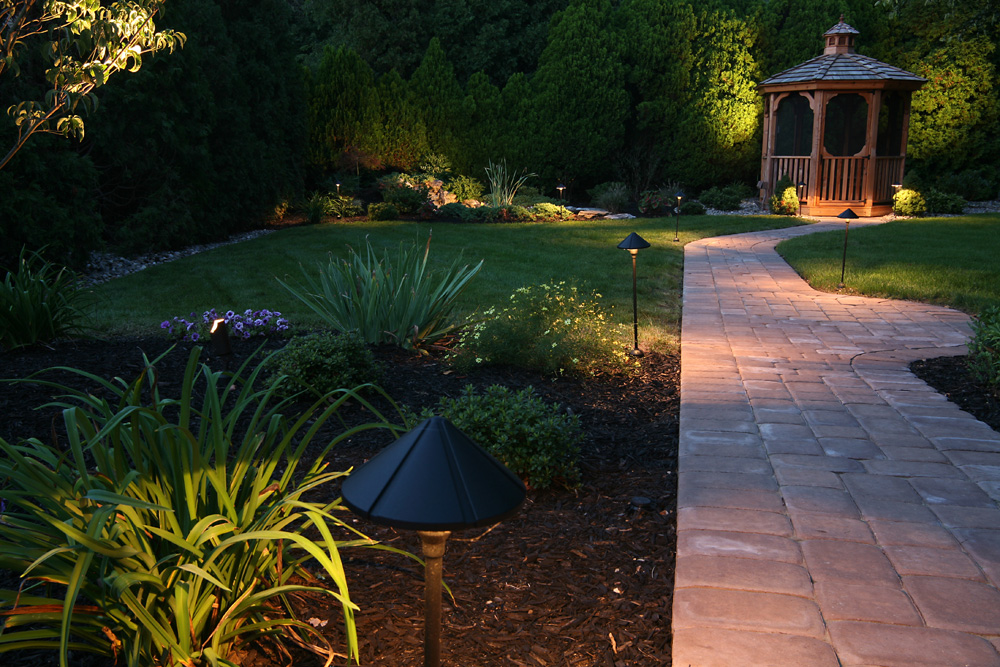 Outdoor lighting on a landscaped backyard