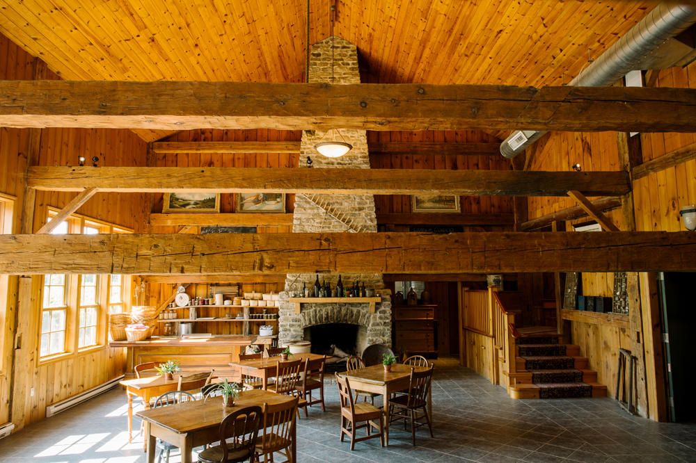 An original late 19th-century fireplace dominates one end of the barn's tasting area