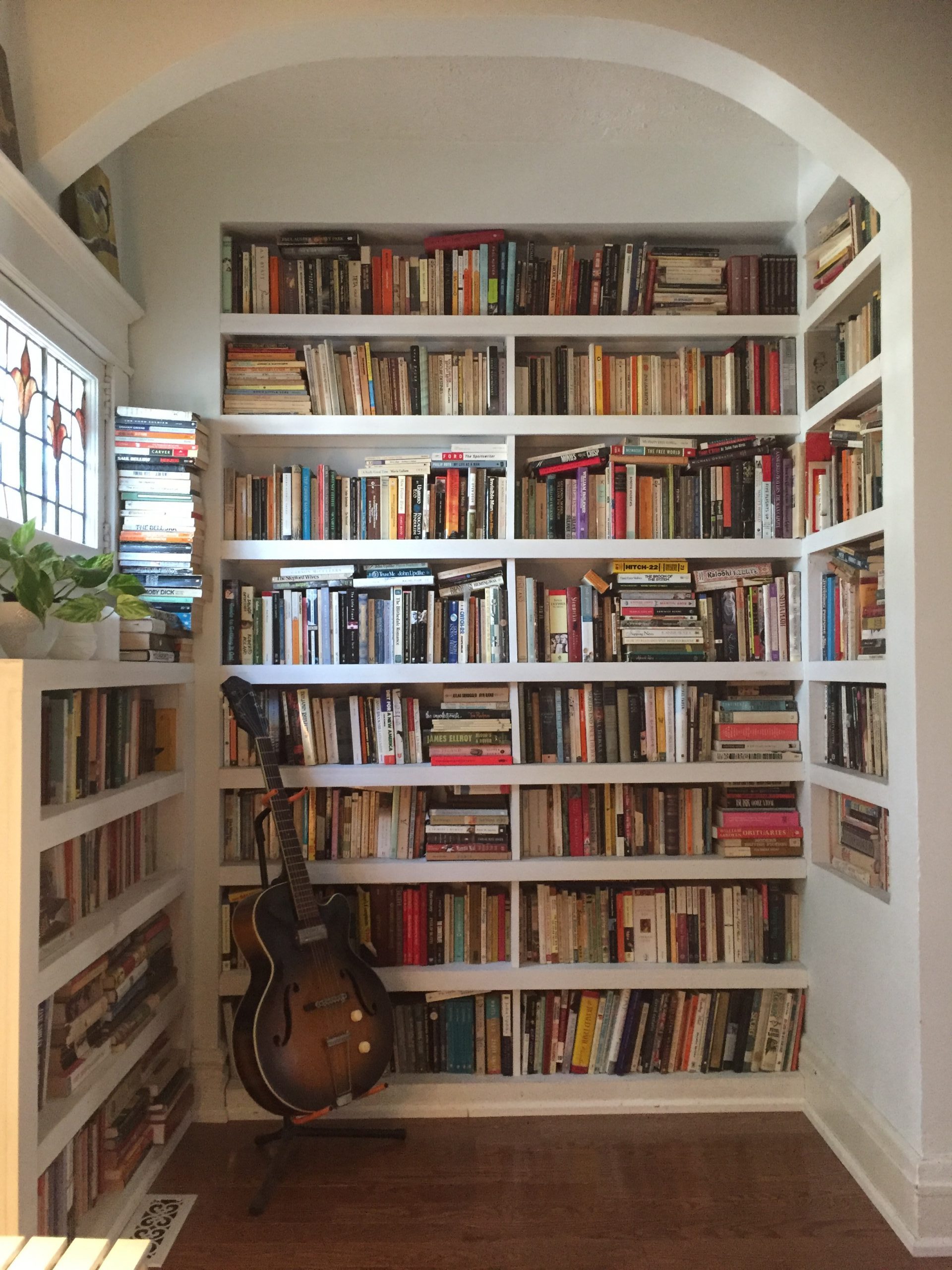 Arched book nook with built-in shelves