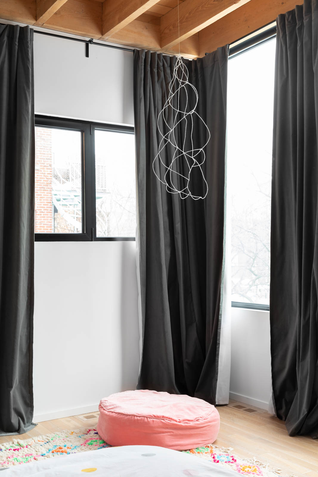 Dramatic black curtains in the master bedroom