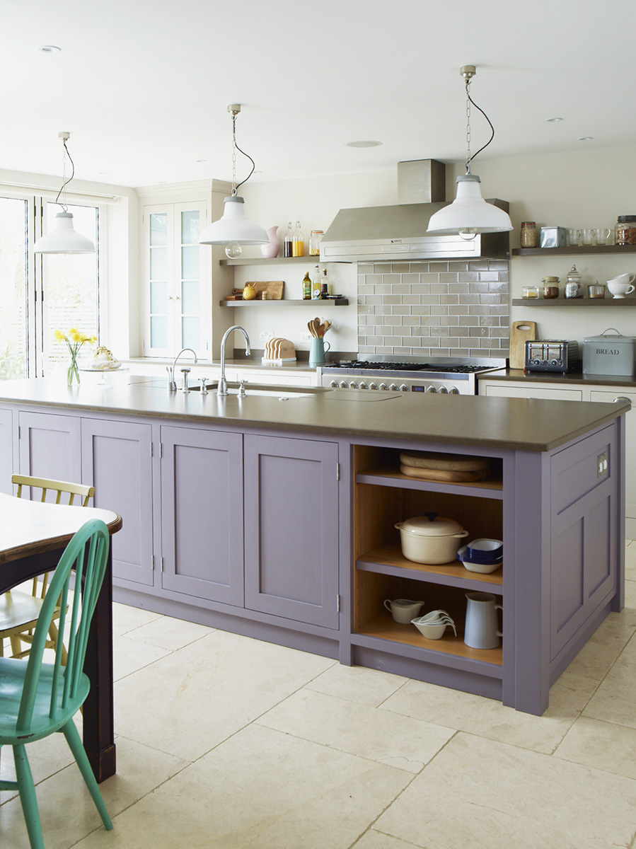 Spacious kitchen with lavender kitchen island.