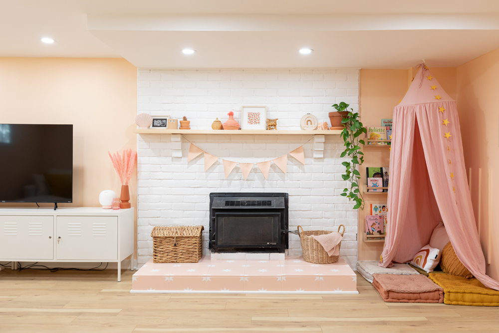 pink basement with white fireplace