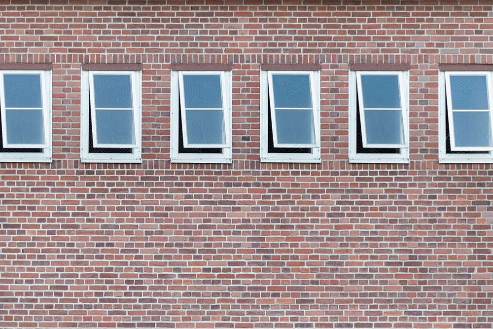 Open windows on a brick building