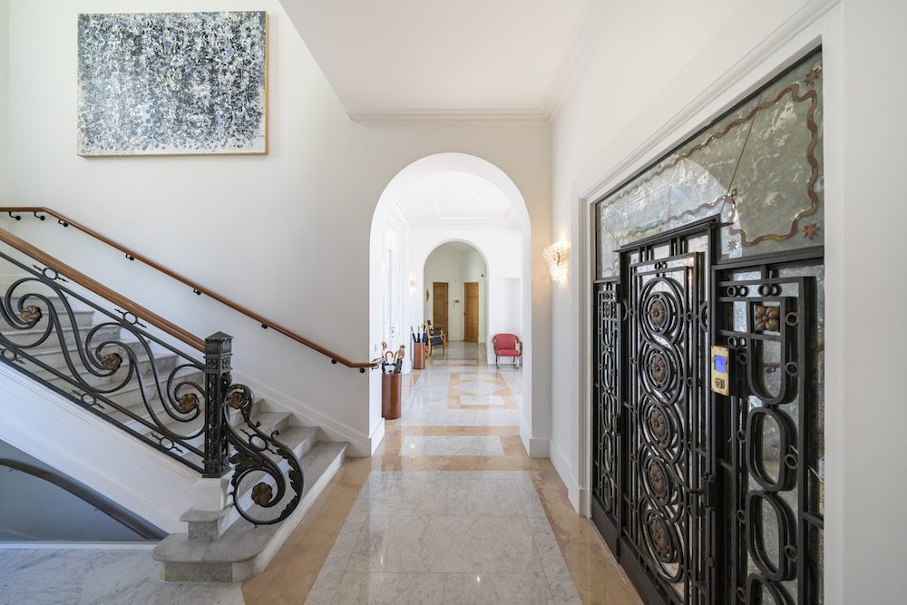 foyer with marble floor and staircase