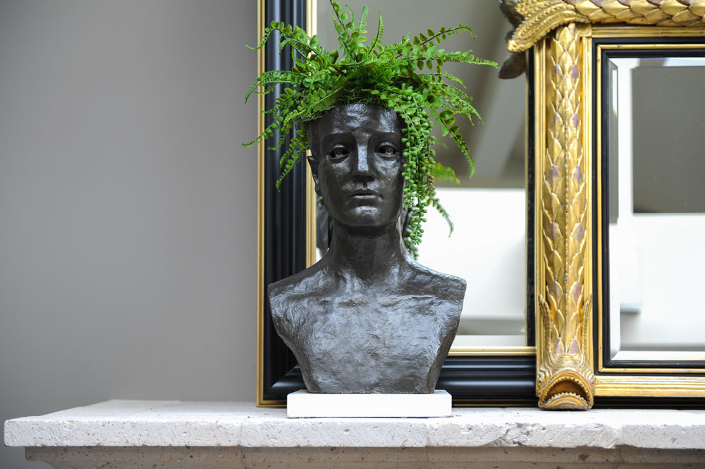 bust with ferns coming out of the top