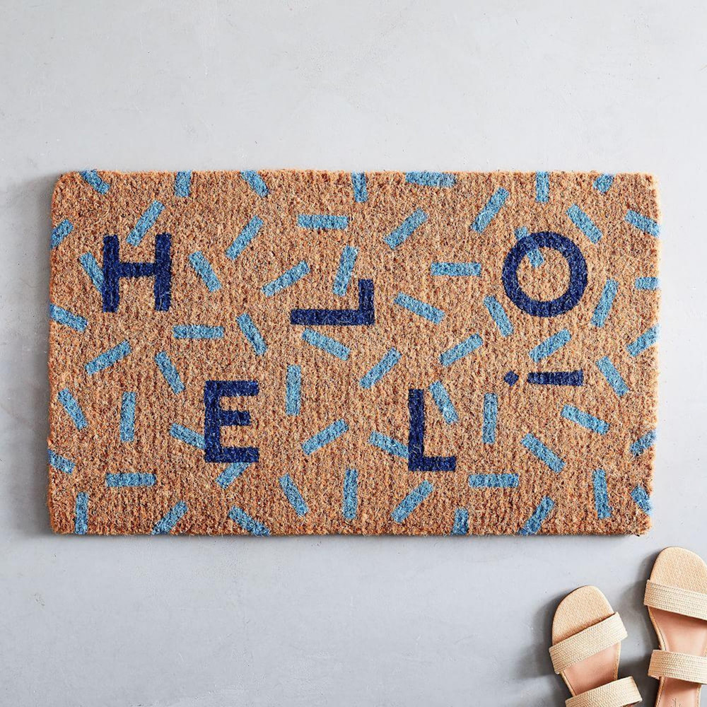 brown doormat with HELLO in blue