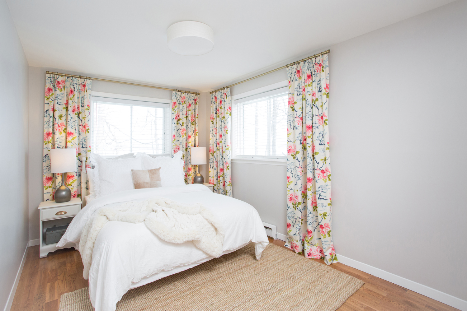 Pretty bedroom with floral curtains