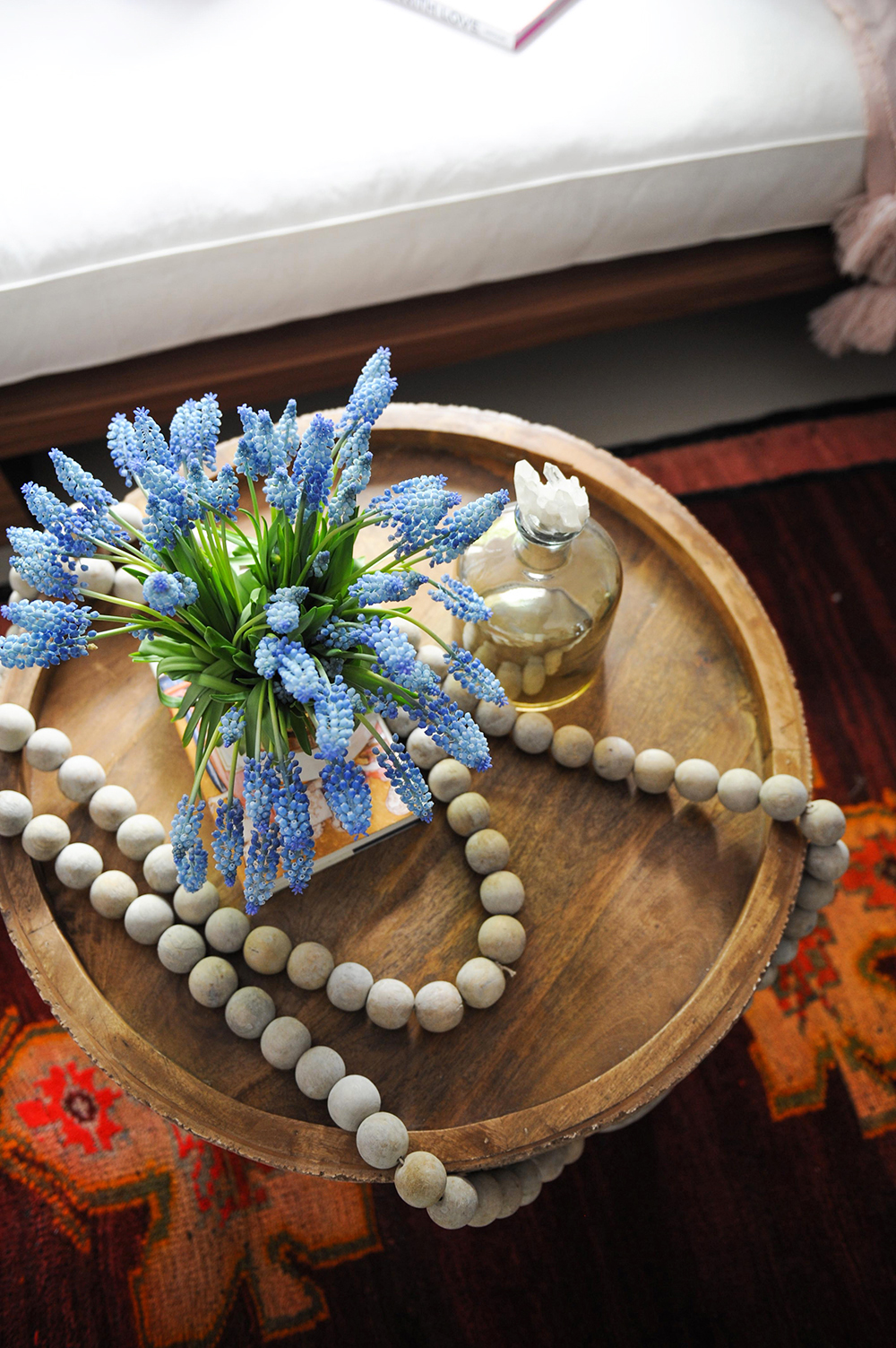 A small circular table with meditation decor on top