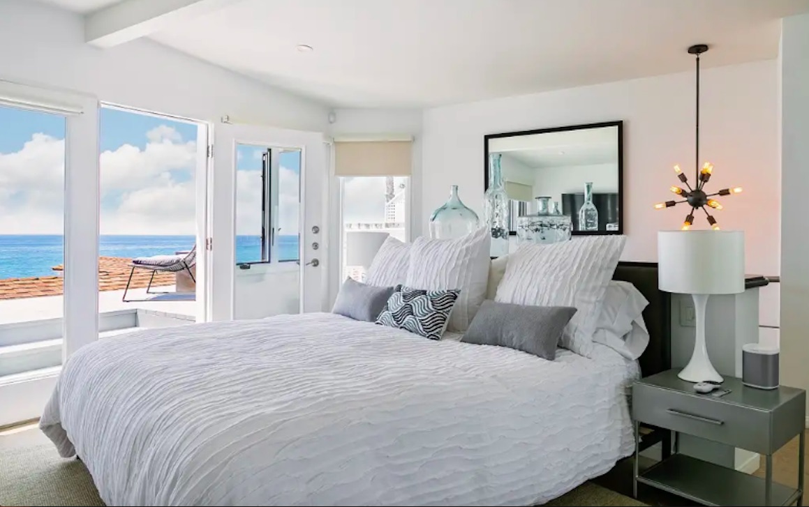 A luxurious king-sized bed and its own private oceanfront deck, overlooking the crashing waves of the Pacific Ocean