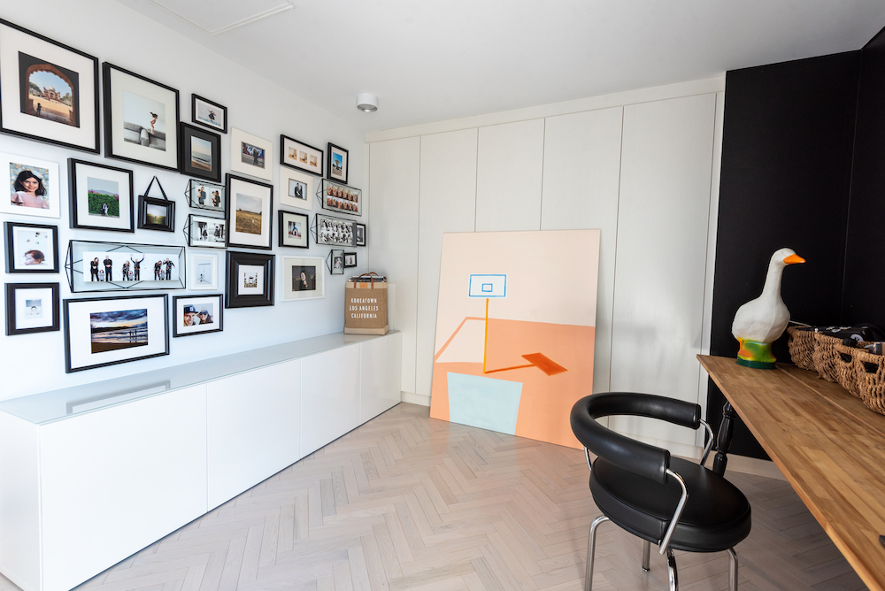 sleek home office with gallery wall
