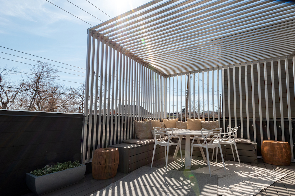 outdoor dining area with slatted pergola