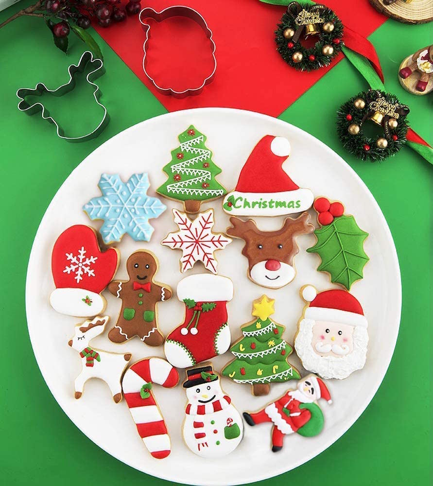 plate of colourful Christmas cookies on green and red surface