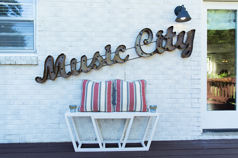A vintage music sign outside a home