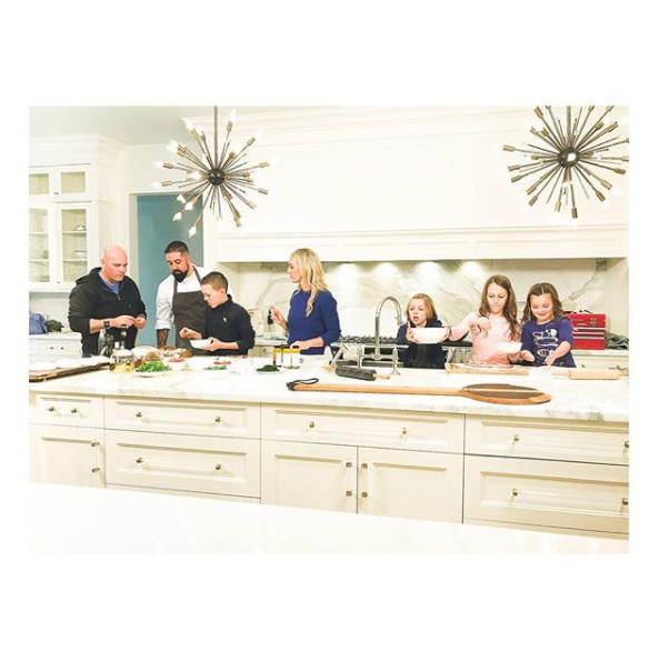 Bryan, Quintyn, Sarah, Lincoln, JoJo and Charlotte Baeumler cooking together.
