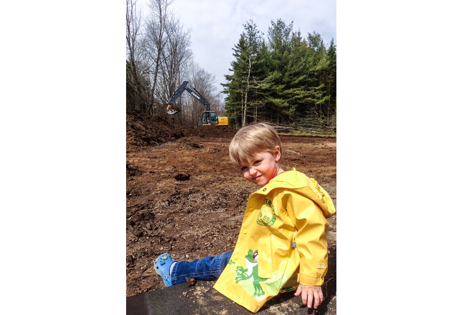 Lincoln Baeumler at a younger age, watching his new house being built.