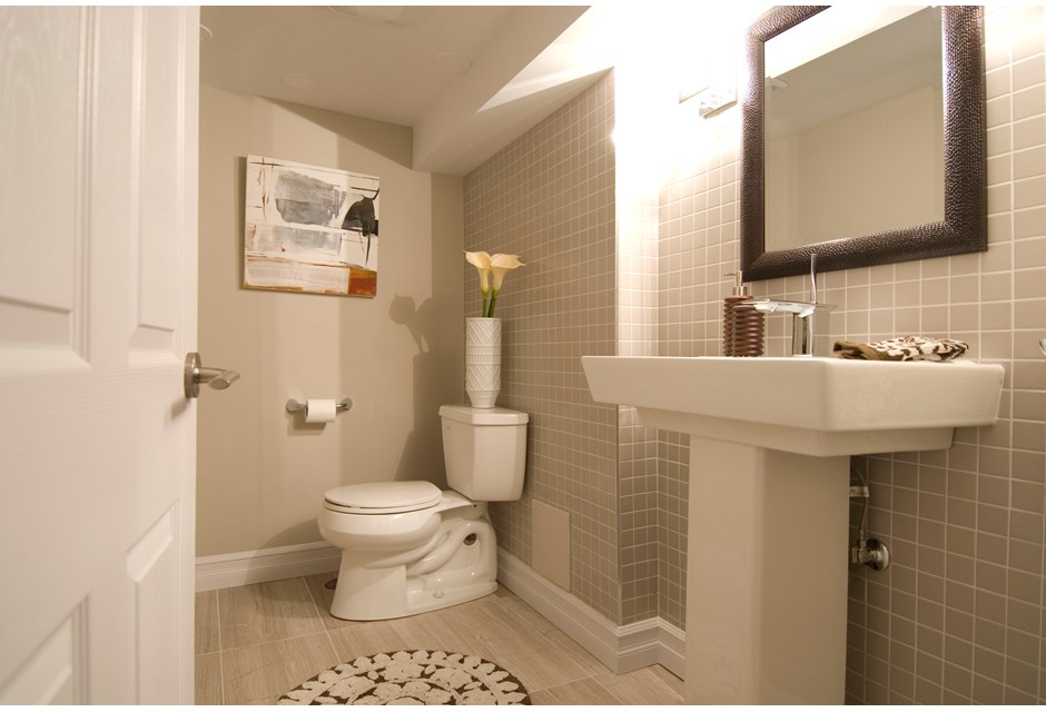 Renovated basement bathroom in neutral tones