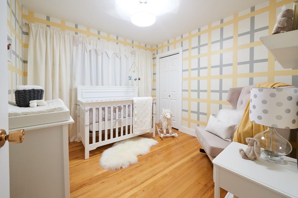 Cheerful kid's room with yellow and blue patterned walls.