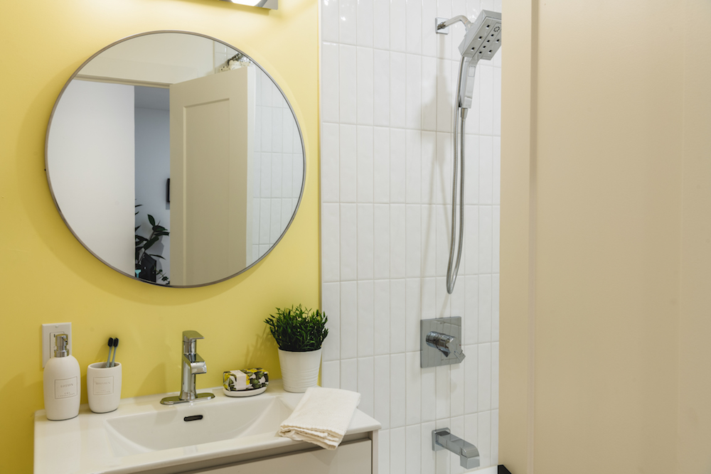 Bathroom with yellow feature wall