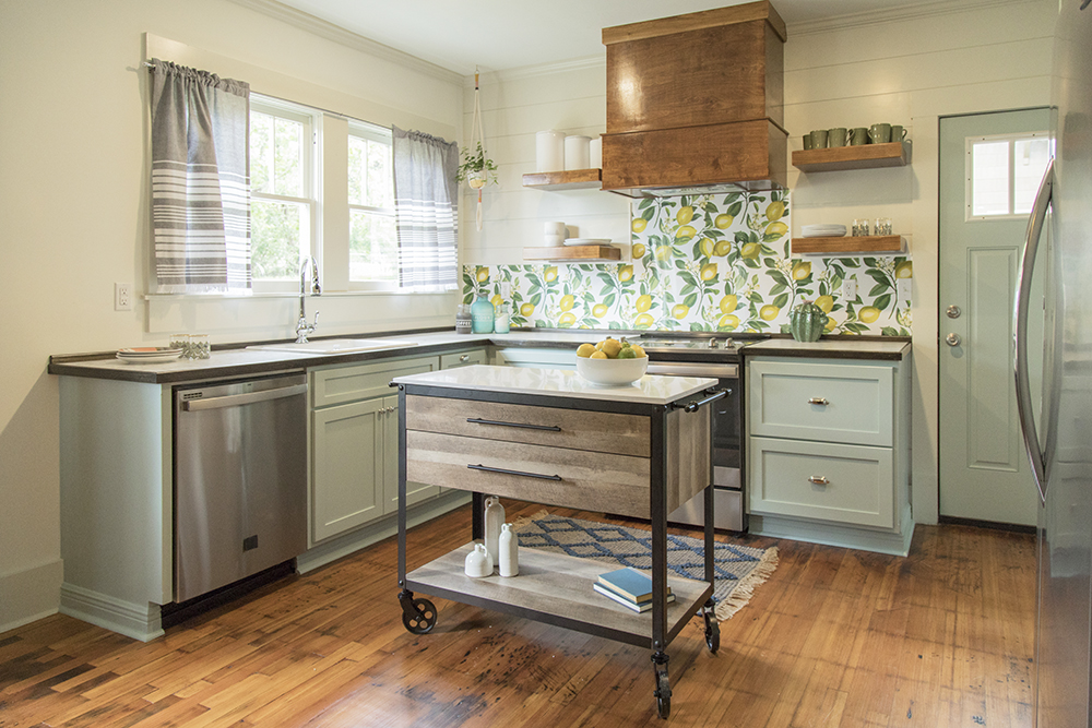 kitchen with green cabinets and lemon-print backsplash