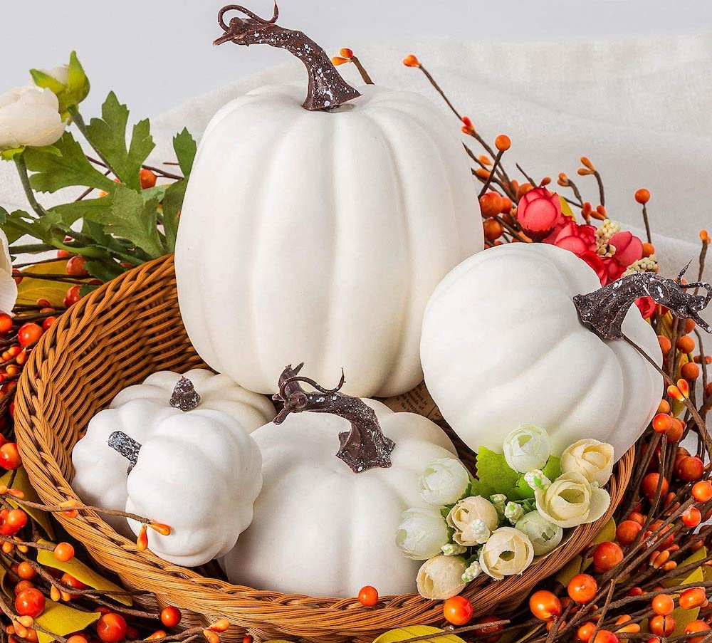 white decorative pumpkins in baskt