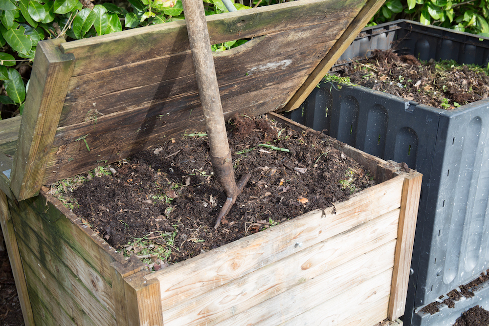 two compost bins in the family garden full