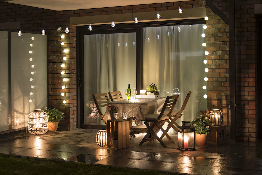 terrace with candles, wine and lights