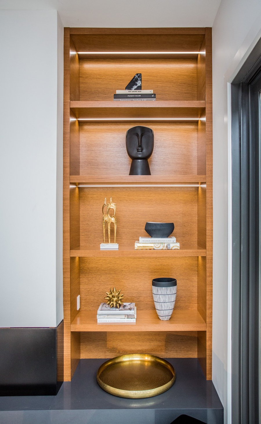 A vertical shelf with minimal items
