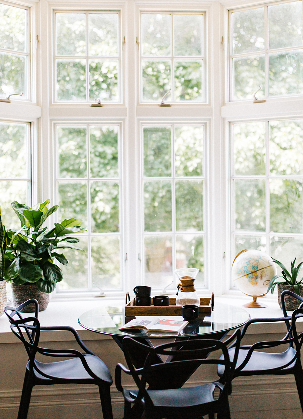 Large glass windows in a dining space or breakfast nook