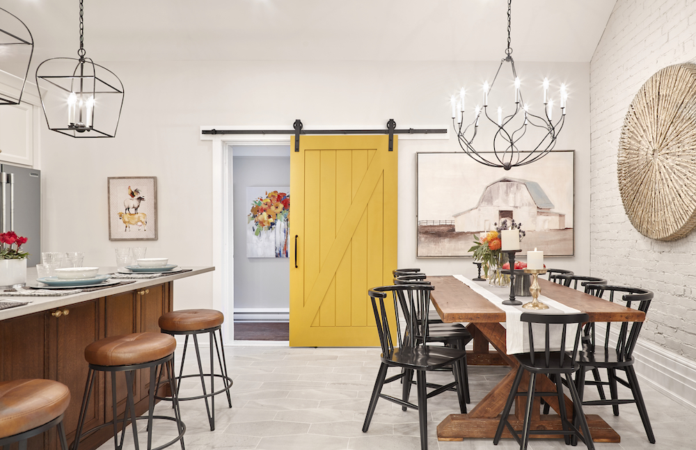 white modern farmhouse kitchen with yellow barn door