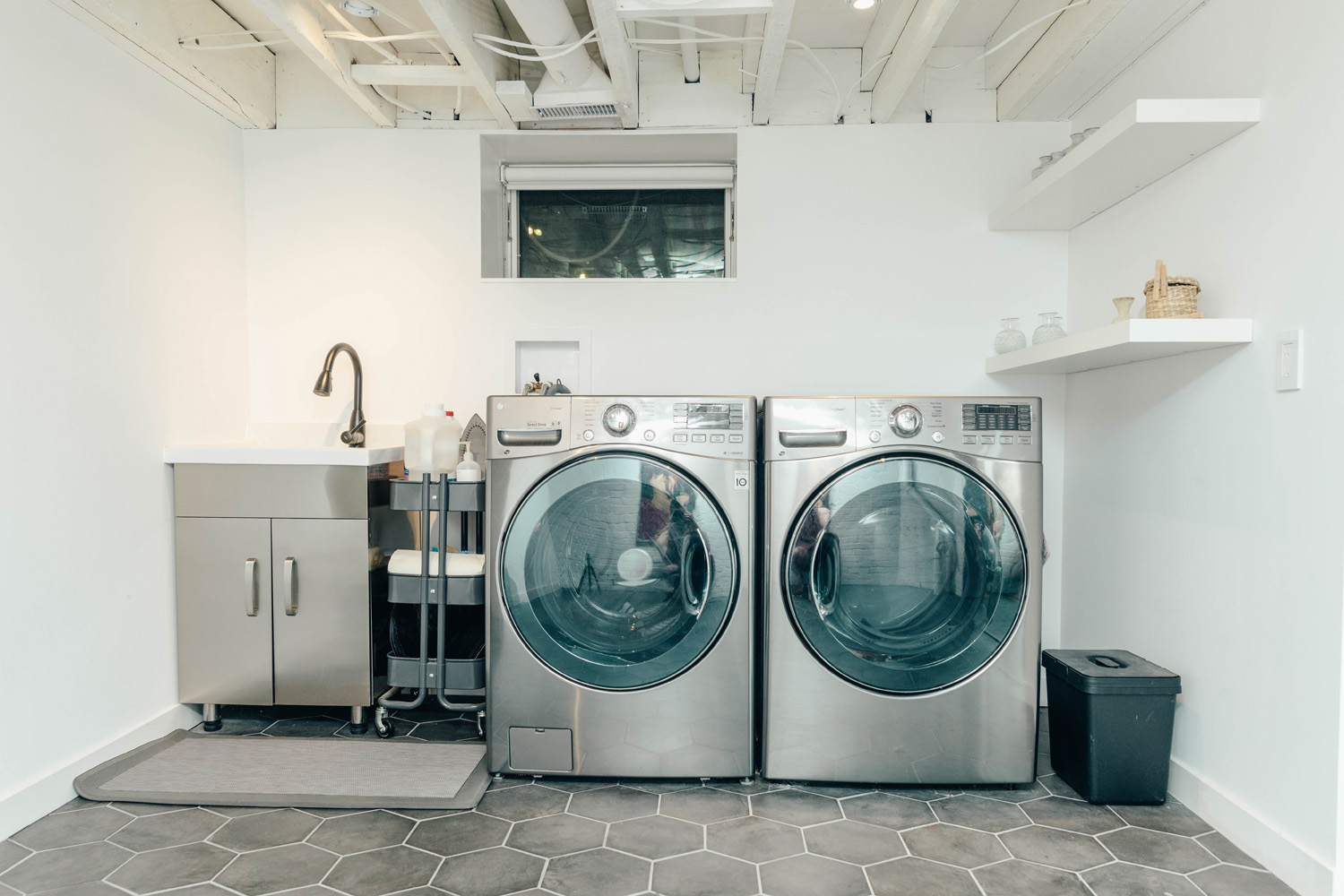 Steel washer-dryer combo in the laundry room