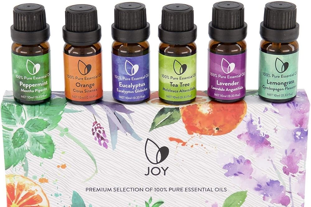 A box of brightly packaged essential oils