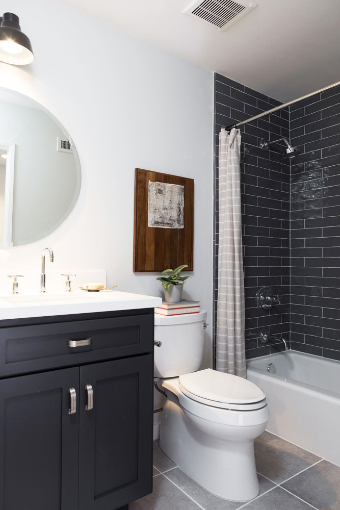 Black brick tile in the shower with a matching vanity