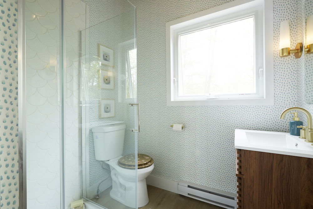 Coastal bathroom with white and blue tiling on walls
