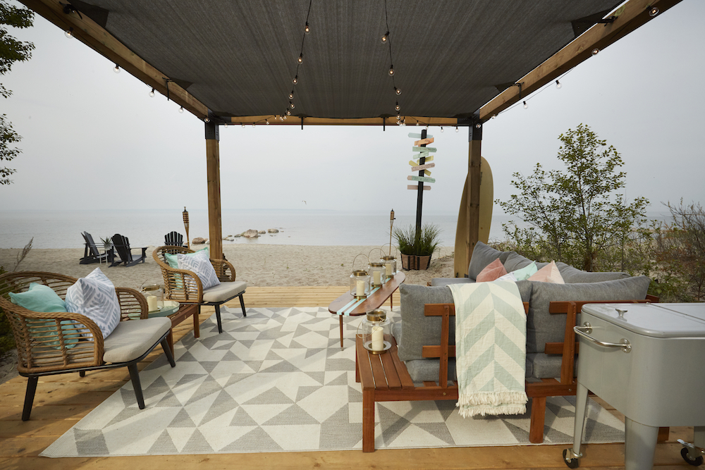 Beach cabana with seating area overlooking the water