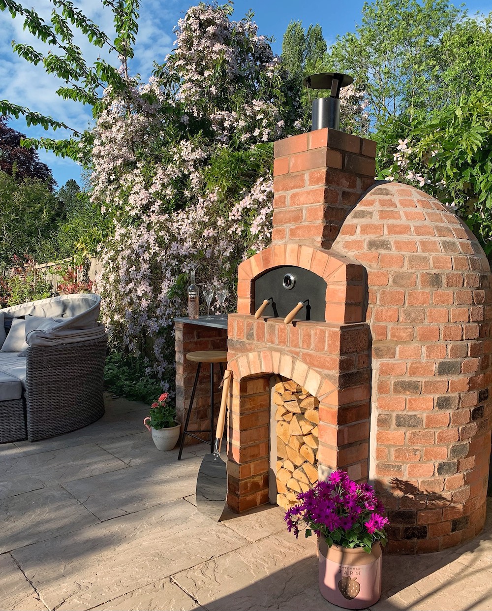 Brick pizza oven in backyard