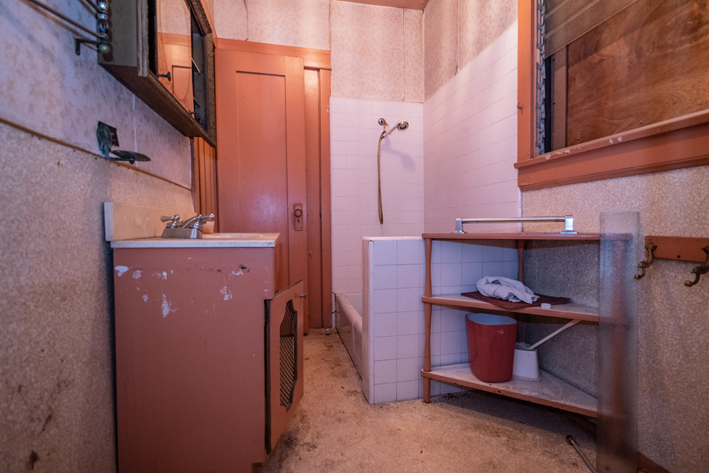 An old dilapidated bathroom in a pre-renovation 1920s-era house