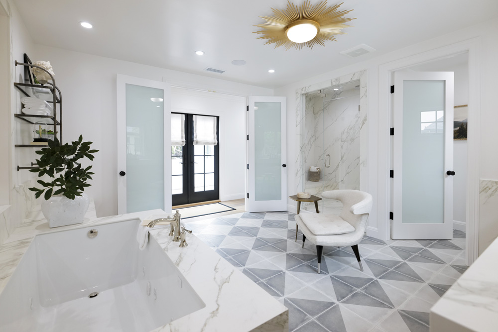 A luxury retreat with a soothing steam shower, gorgeous floor tiles and stunning stone slabs
