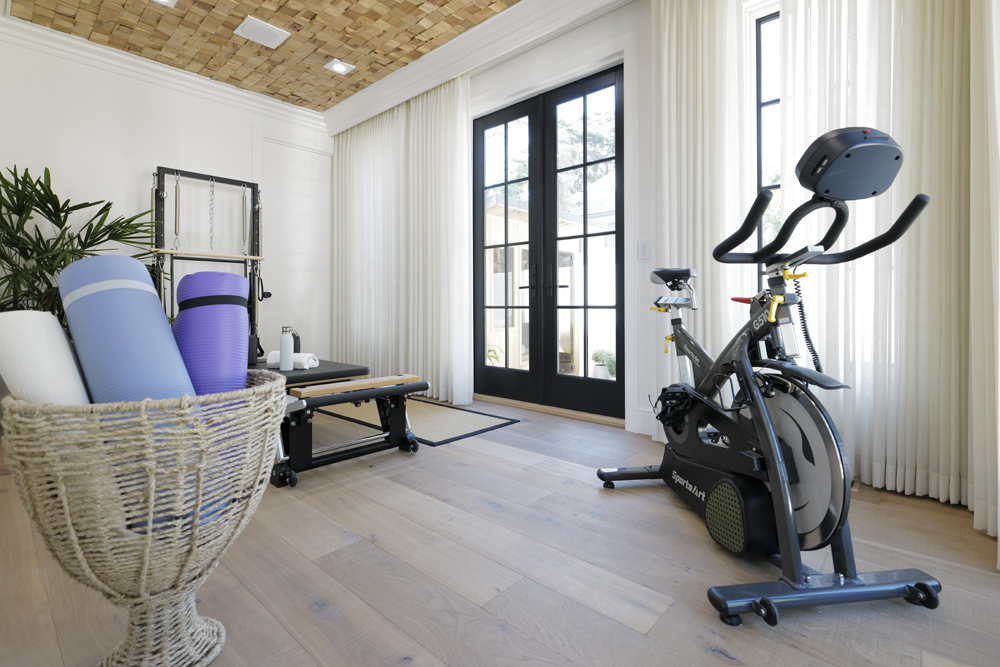 A renovated mini gym with space for yoga and workout equipment in the guest house