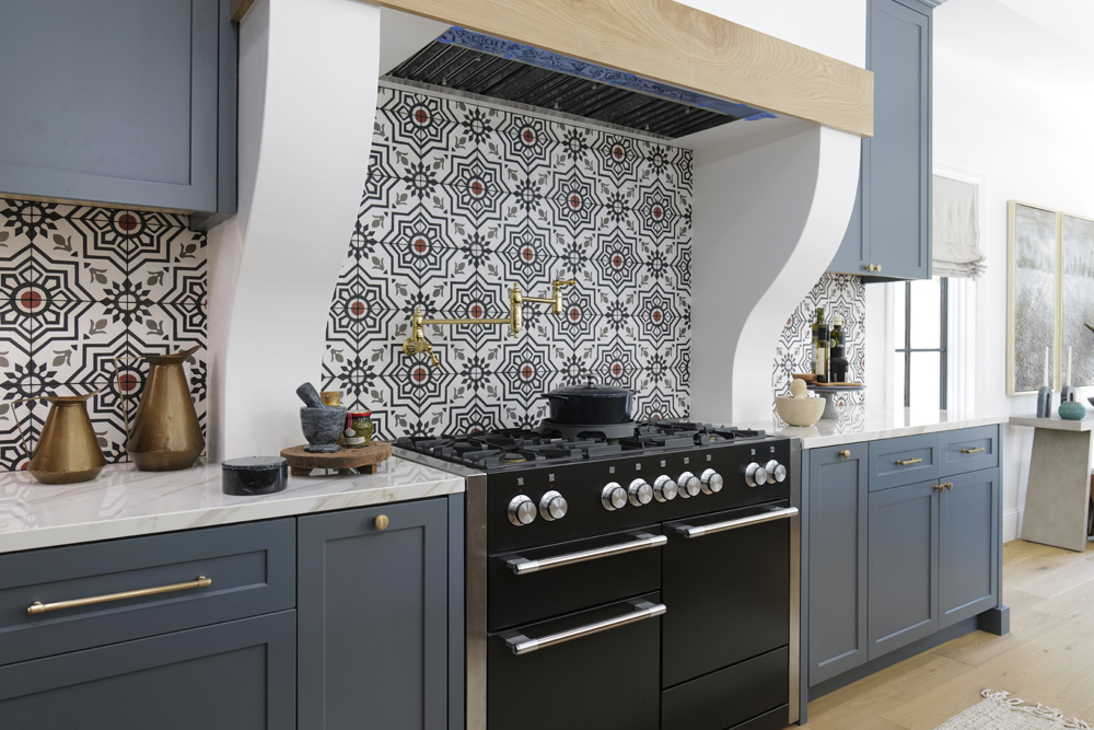 A renovated kitchen with a Spanish-inspired backsplash