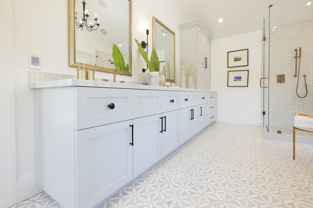Double vanity with plenty of storage in a soothing Spanish-inspired bathroom renovation