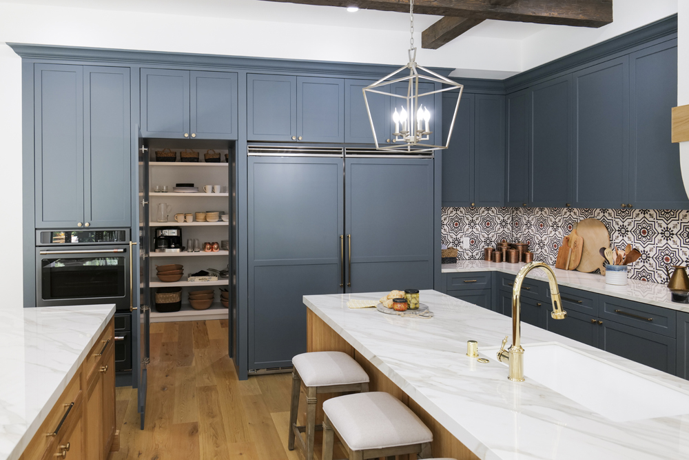 A kitchen renovation with extensive storage and a hidden walk-in pantry